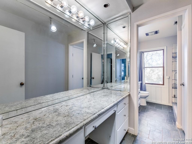 bathroom with vanity and toilet