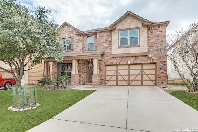 view of front of house featuring a garage and a front yard