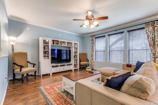 living room featuring ornamental molding, dark hardwood / wood-style floors, and ceiling fan