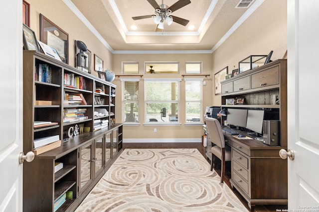 office featuring crown molding, hardwood / wood-style flooring, ceiling fan, a tray ceiling, and a textured ceiling