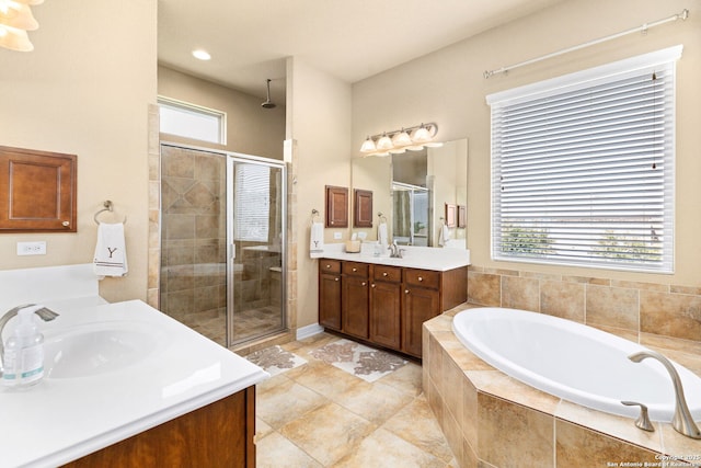 bathroom featuring vanity and plus walk in shower