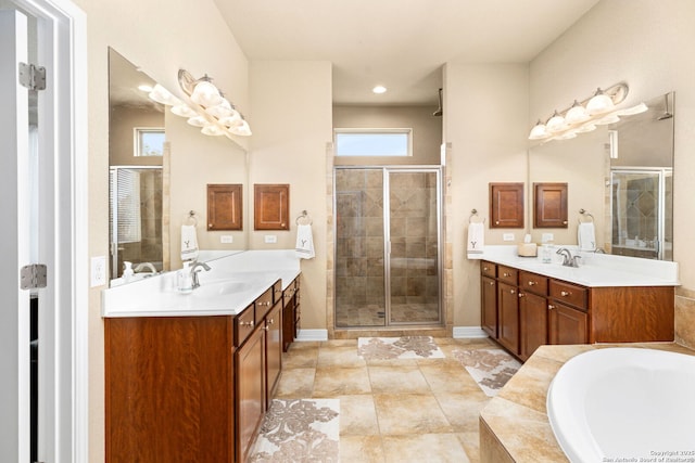 bathroom featuring vanity and shower with separate bathtub