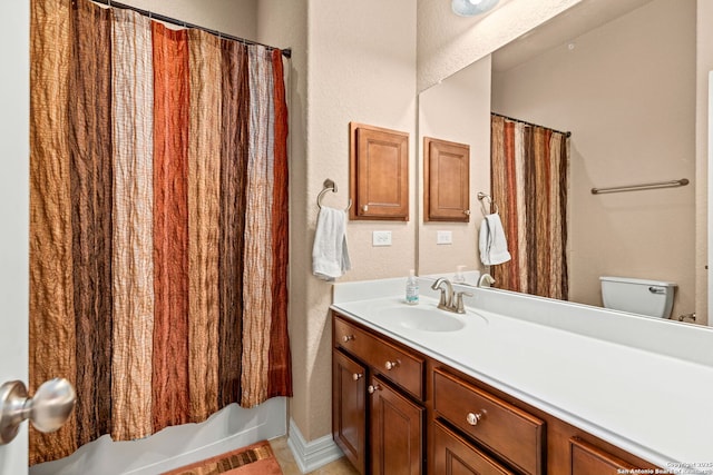 full bathroom featuring vanity, toilet, tile patterned flooring, and shower / bath combo