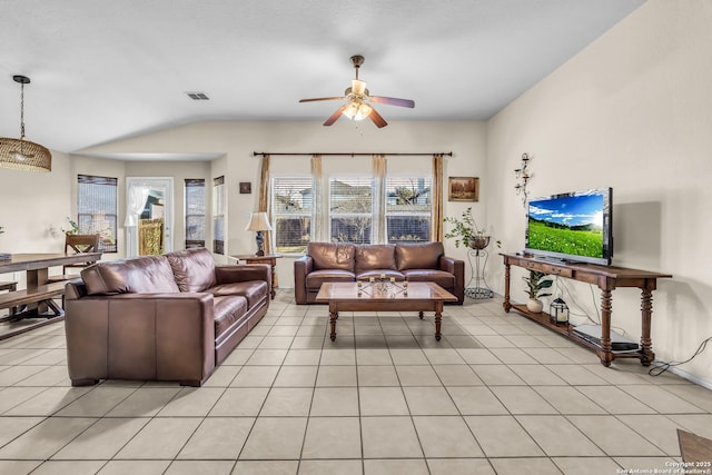 tiled living room featuring lofted ceiling and ceiling fan