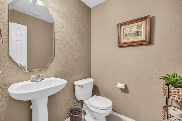 bathroom featuring toilet