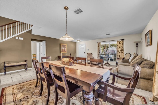 dining area with light tile patterned flooring