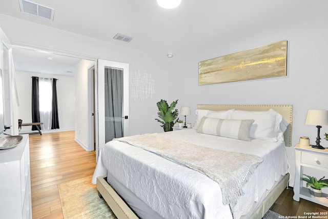 bedroom featuring wood-type flooring