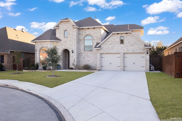 view of front facade featuring a garage and a front lawn