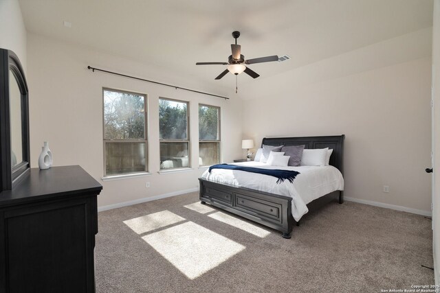 bedroom with ceiling fan and carpet flooring