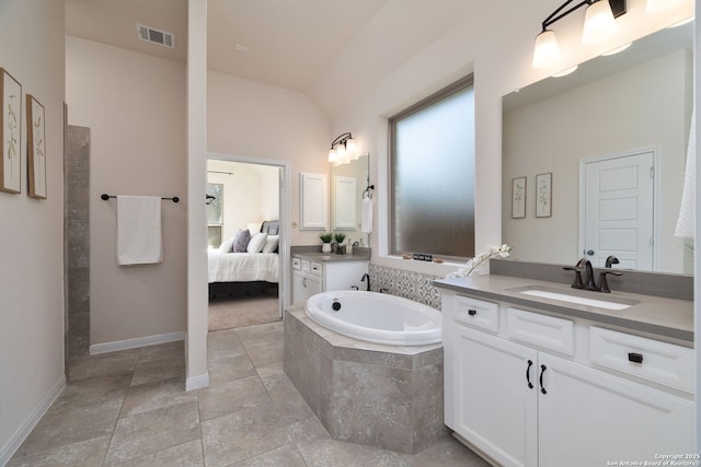 bathroom featuring vanity and vaulted ceiling