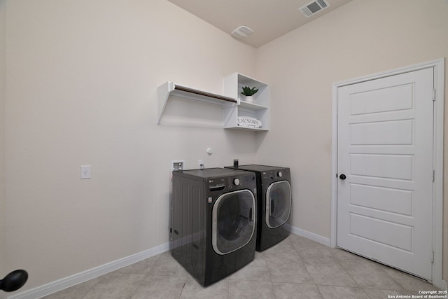 clothes washing area featuring washing machine and clothes dryer