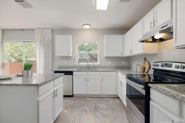 kitchen featuring under cabinet range hood, white cabinetry, visible vents, and appliances with stainless steel finishes