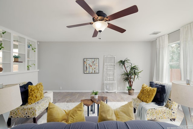 living room featuring visible vents and baseboards