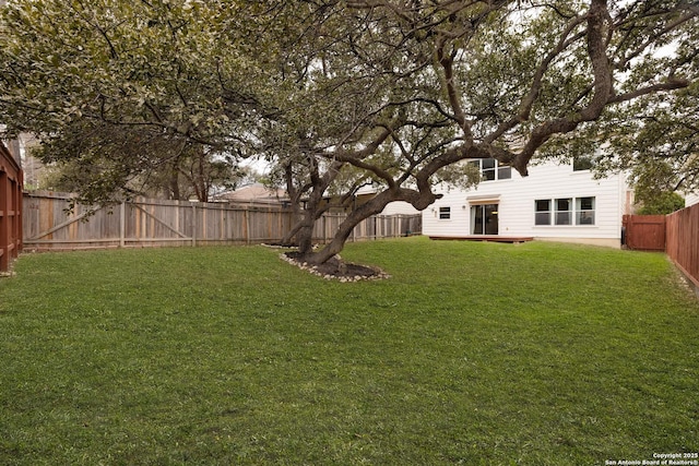 view of yard featuring a fenced backyard