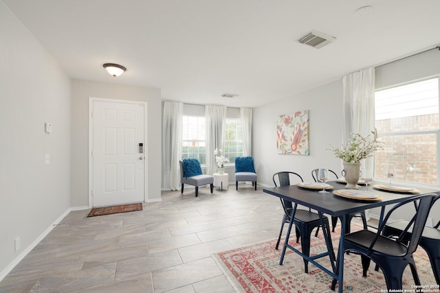 dining space with visible vents and baseboards