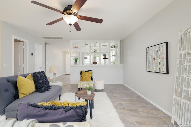 living room with visible vents and baseboards