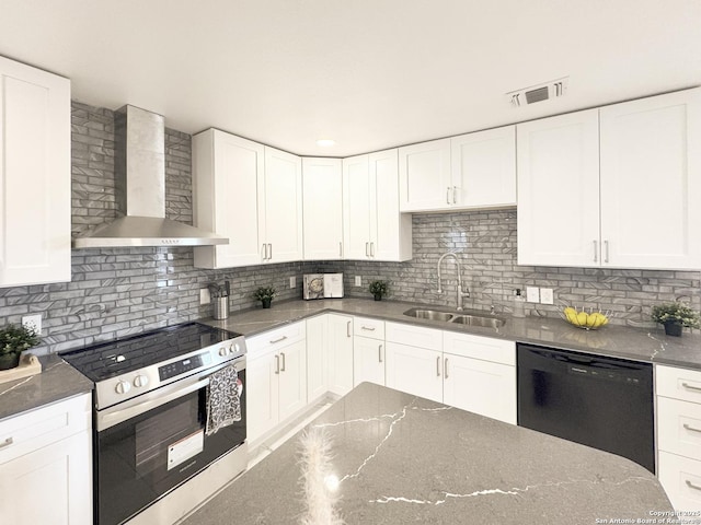 kitchen with sink, dishwasher, electric stove, wall chimney range hood, and white cabinets