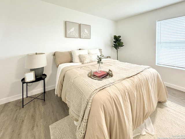 bedroom with hardwood / wood-style flooring