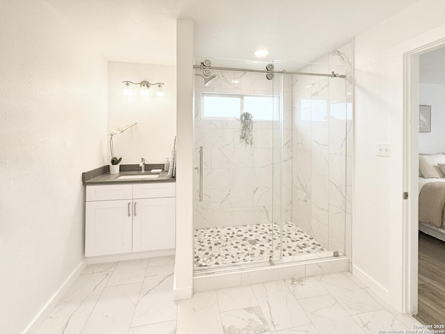 bathroom with vanity and a shower with shower door