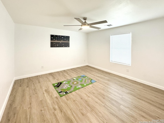 unfurnished room featuring ceiling fan and light wood-type flooring