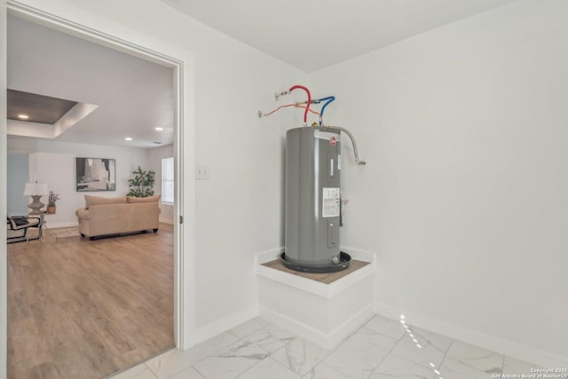 utility room with electric water heater