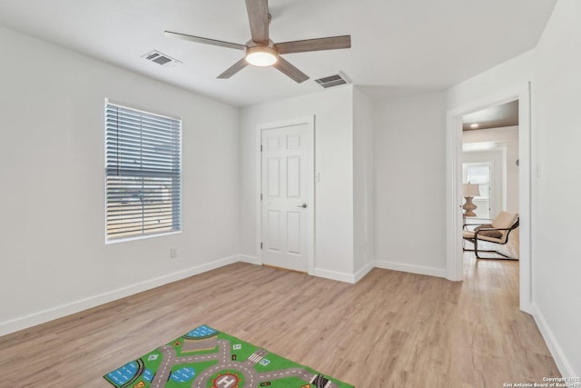 interior space with light hardwood / wood-style flooring and ceiling fan