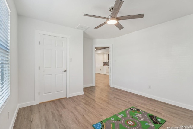 unfurnished bedroom featuring ceiling fan and light hardwood / wood-style flooring