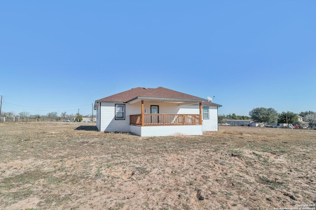 rear view of house with a lawn