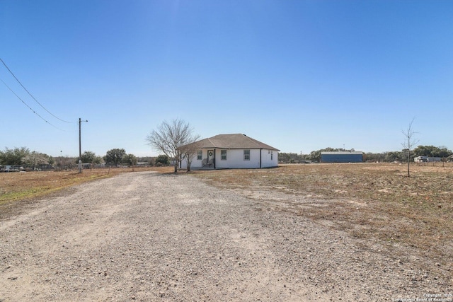 view of front of house featuring a rural view