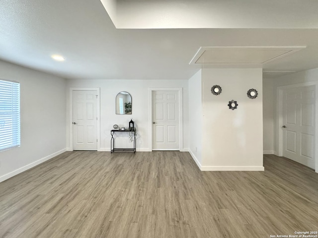 unfurnished living room featuring hardwood / wood-style floors