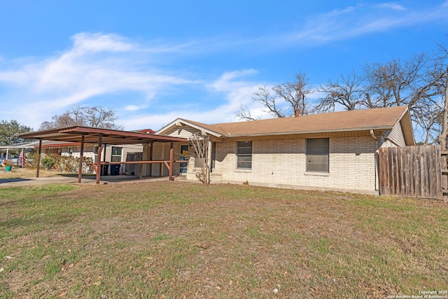 view of front facade featuring a patio and a front lawn