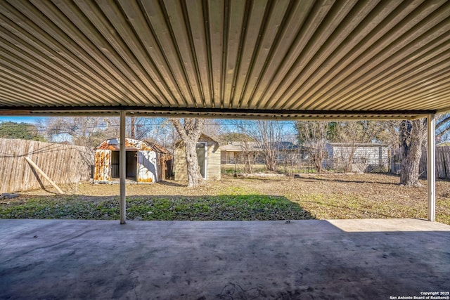 view of patio / terrace featuring a storage unit