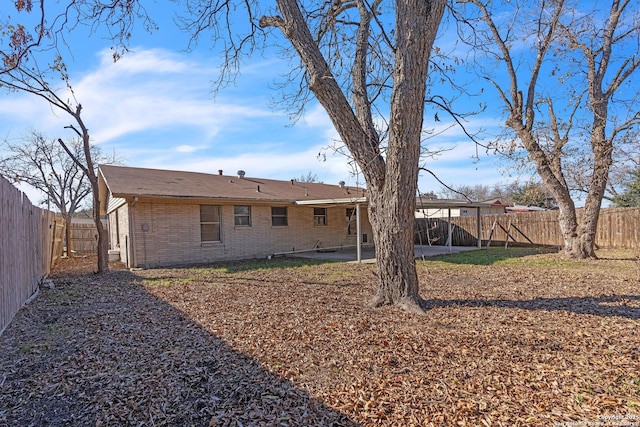 back of house with a patio