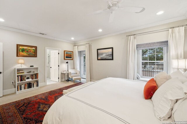 carpeted bedroom featuring ornamental molding and ceiling fan