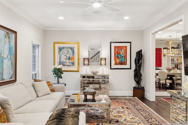 living room with ornamental molding, dark hardwood / wood-style floors, and ceiling fan