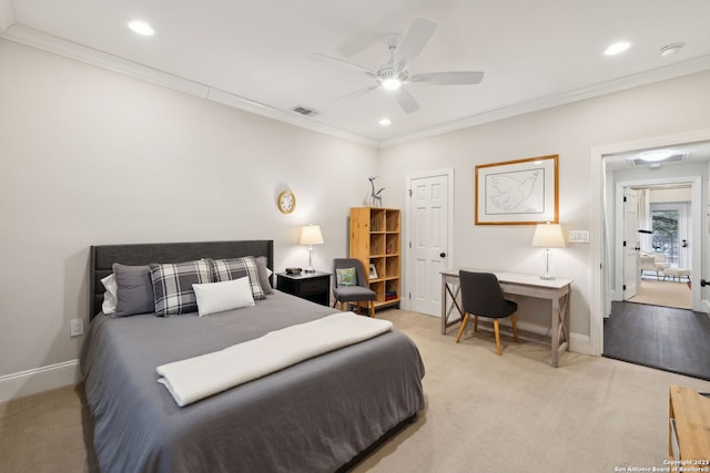 bedroom featuring light carpet, ornamental molding, and ceiling fan