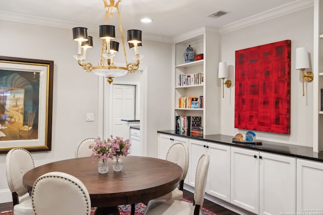 dining space featuring crown molding and a chandelier