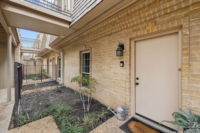 entrance to property featuring a balcony