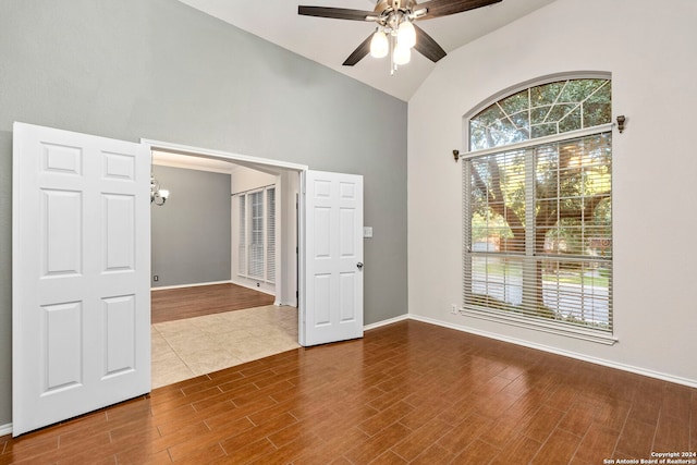 spare room with vaulted ceiling and ceiling fan