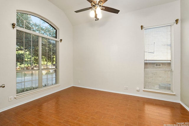 unfurnished room with ceiling fan and lofted ceiling