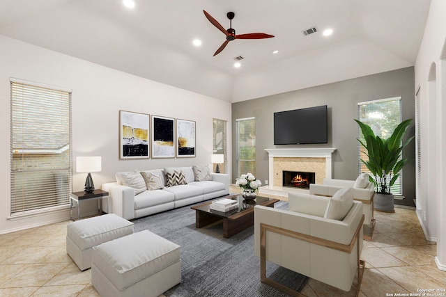 tiled living room with high vaulted ceiling and ceiling fan