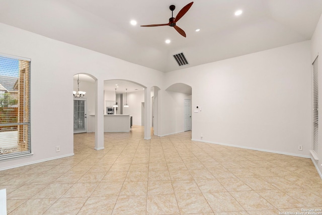 empty room with light tile patterned floors and ceiling fan