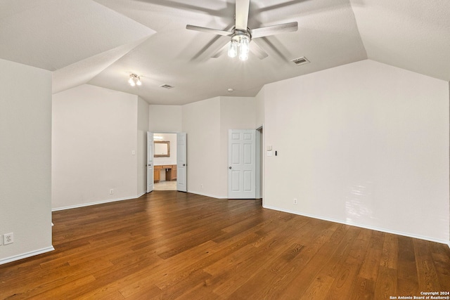 unfurnished room featuring ceiling fan, wood-type flooring, and vaulted ceiling