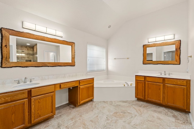 bathroom with lofted ceiling, vanity, and separate shower and tub