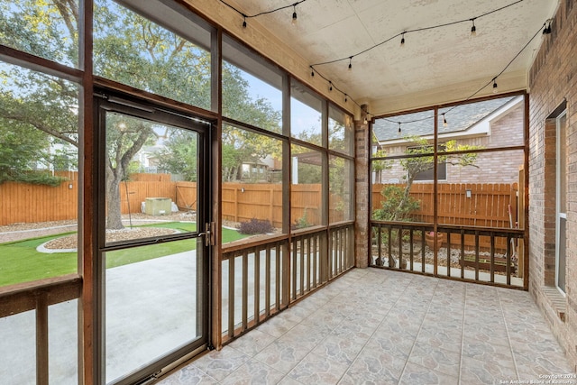 unfurnished sunroom featuring plenty of natural light