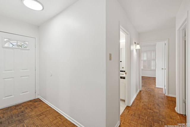 entrance foyer with dark parquet flooring