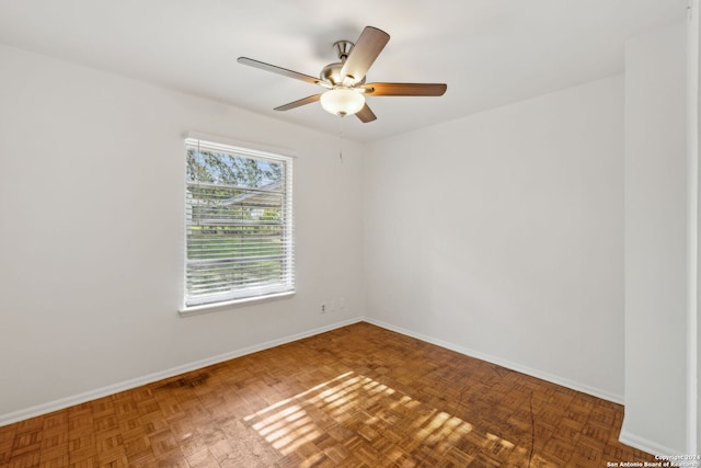 unfurnished room with parquet flooring and ceiling fan