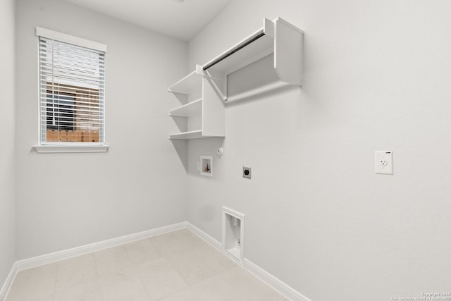 clothes washing area with hookup for a gas dryer, hookup for an electric dryer, laundry area, washer hookup, and baseboards