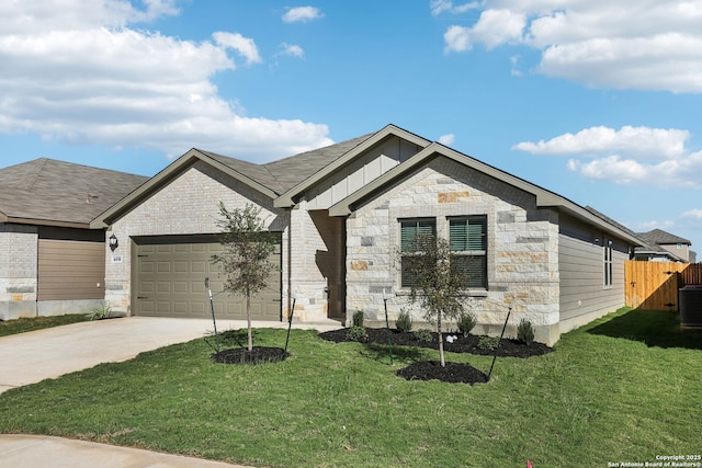 view of front of house with a garage and a front lawn