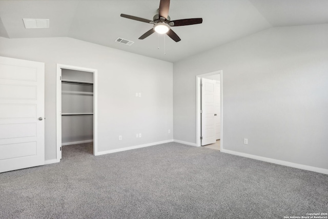 unfurnished bedroom featuring ceiling fan, lofted ceiling, and light carpet